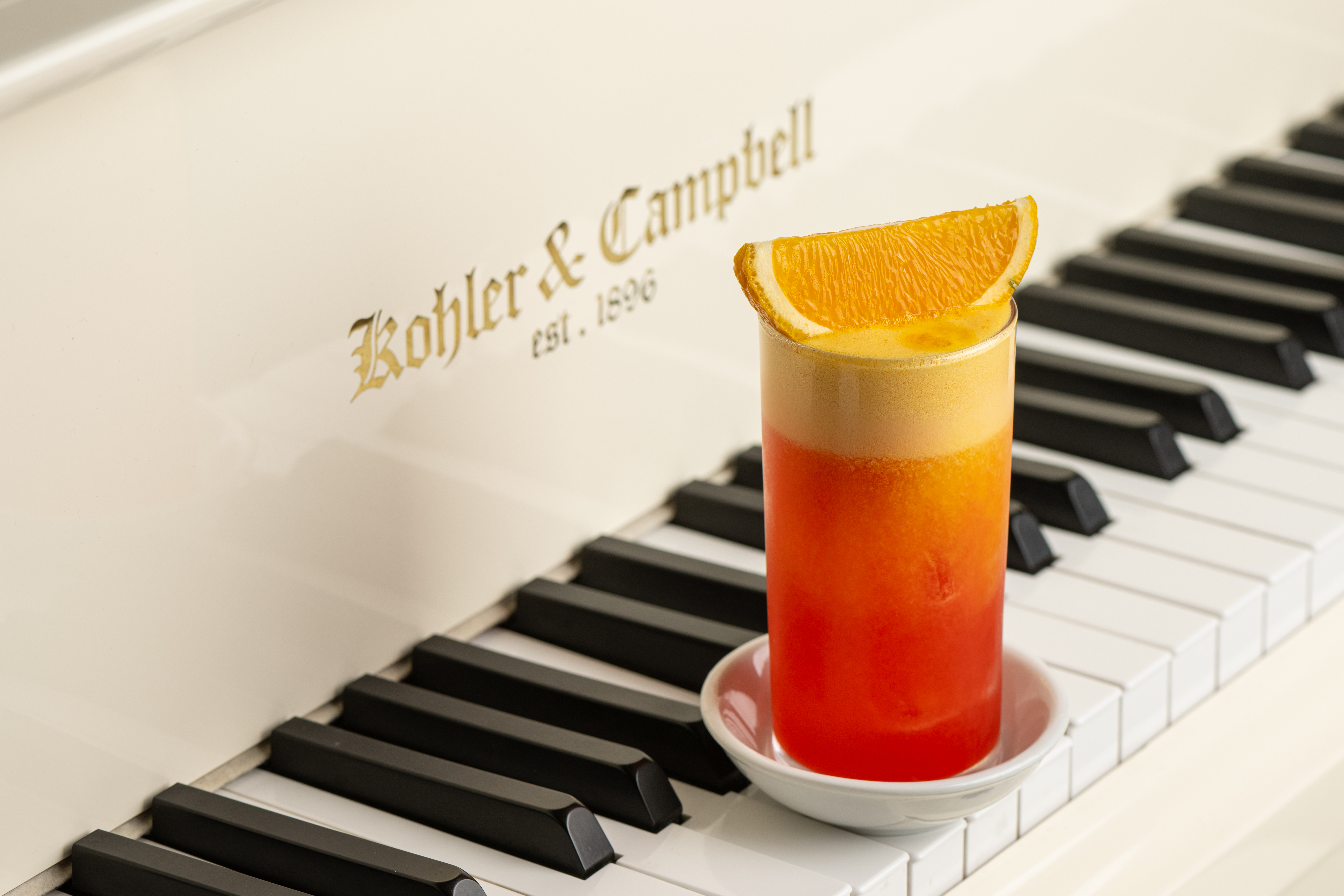 a piano keyboard and a cup of coffee