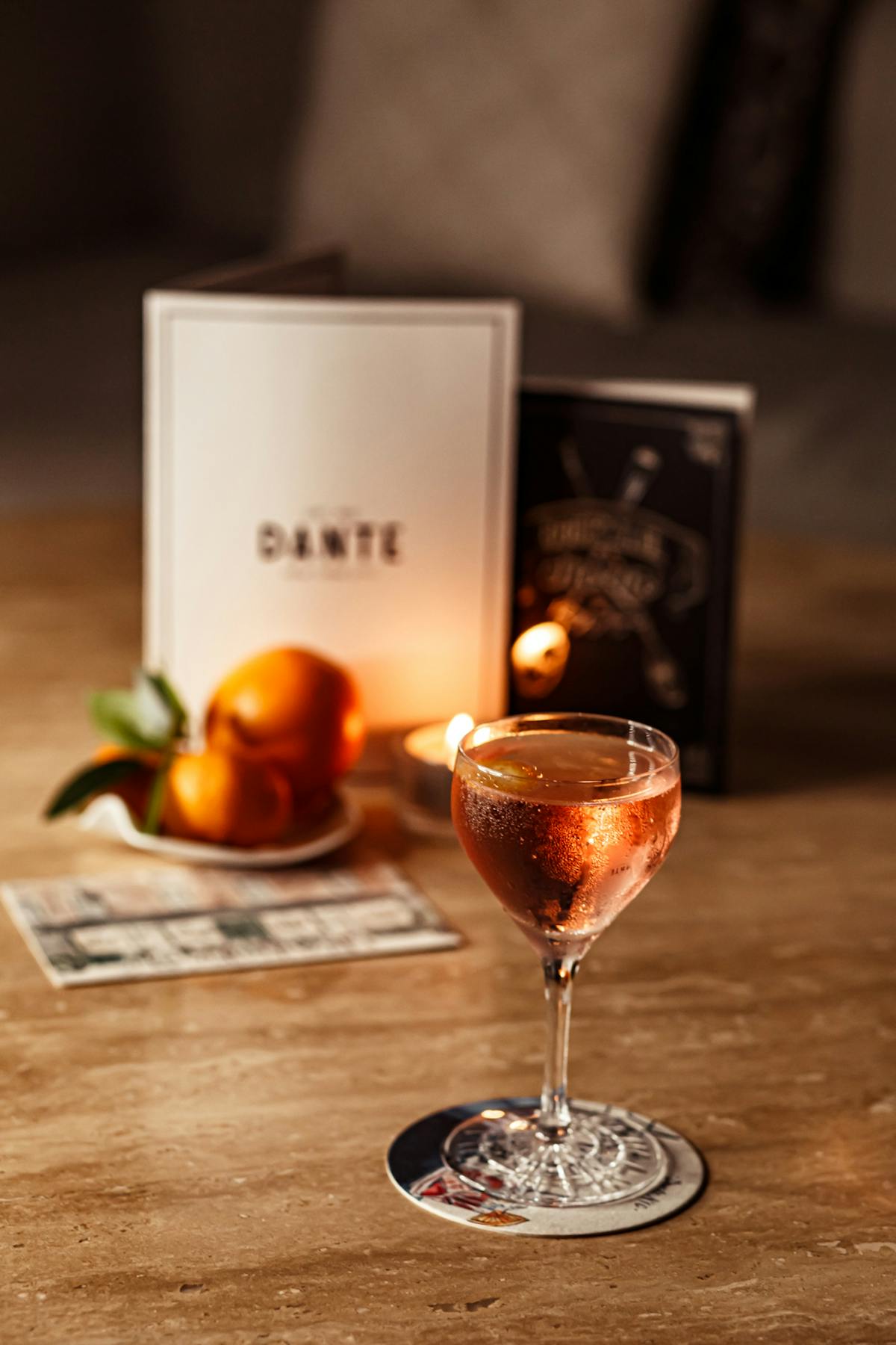 a glass of wine sitting on top of a wooden table