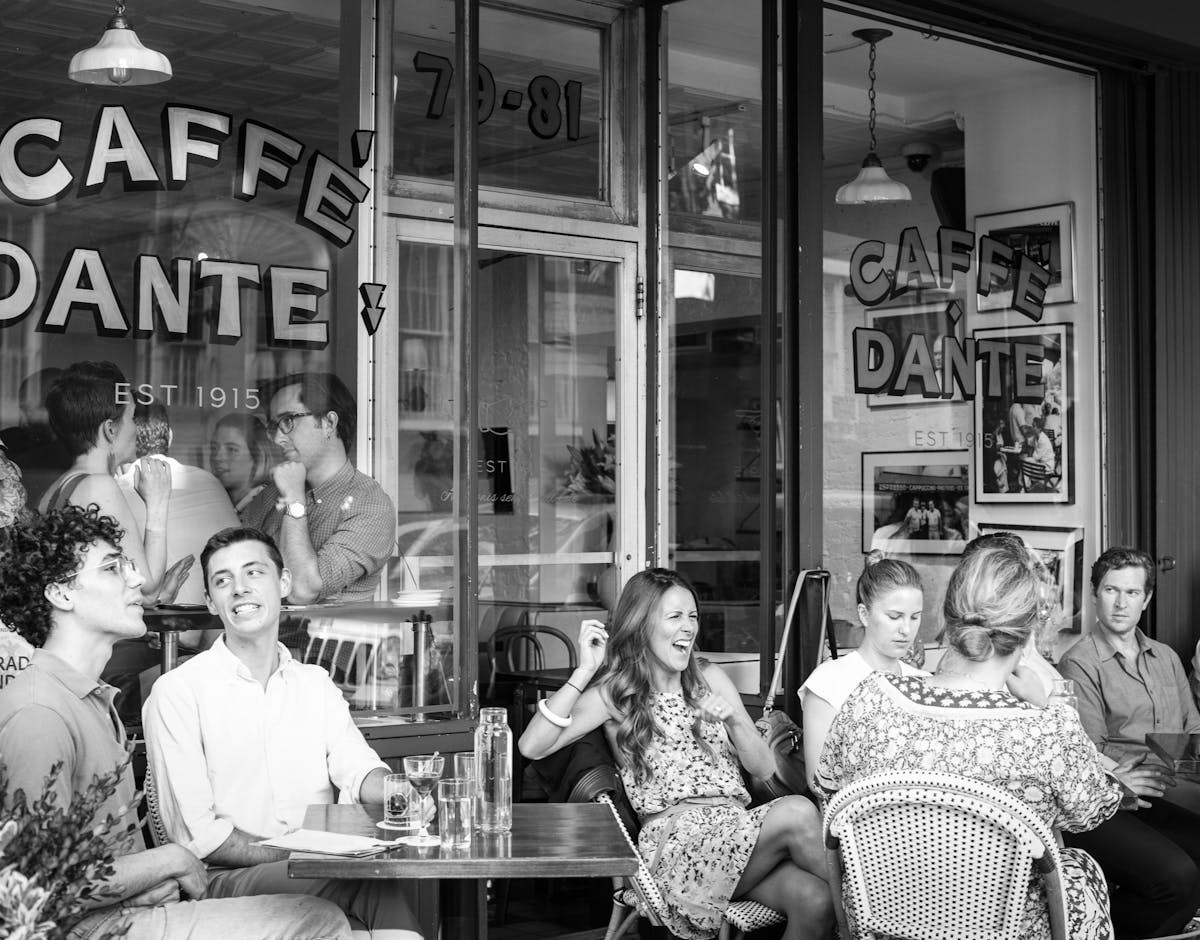 Rafael da Silva Nascimento et al. sitting in front of a store