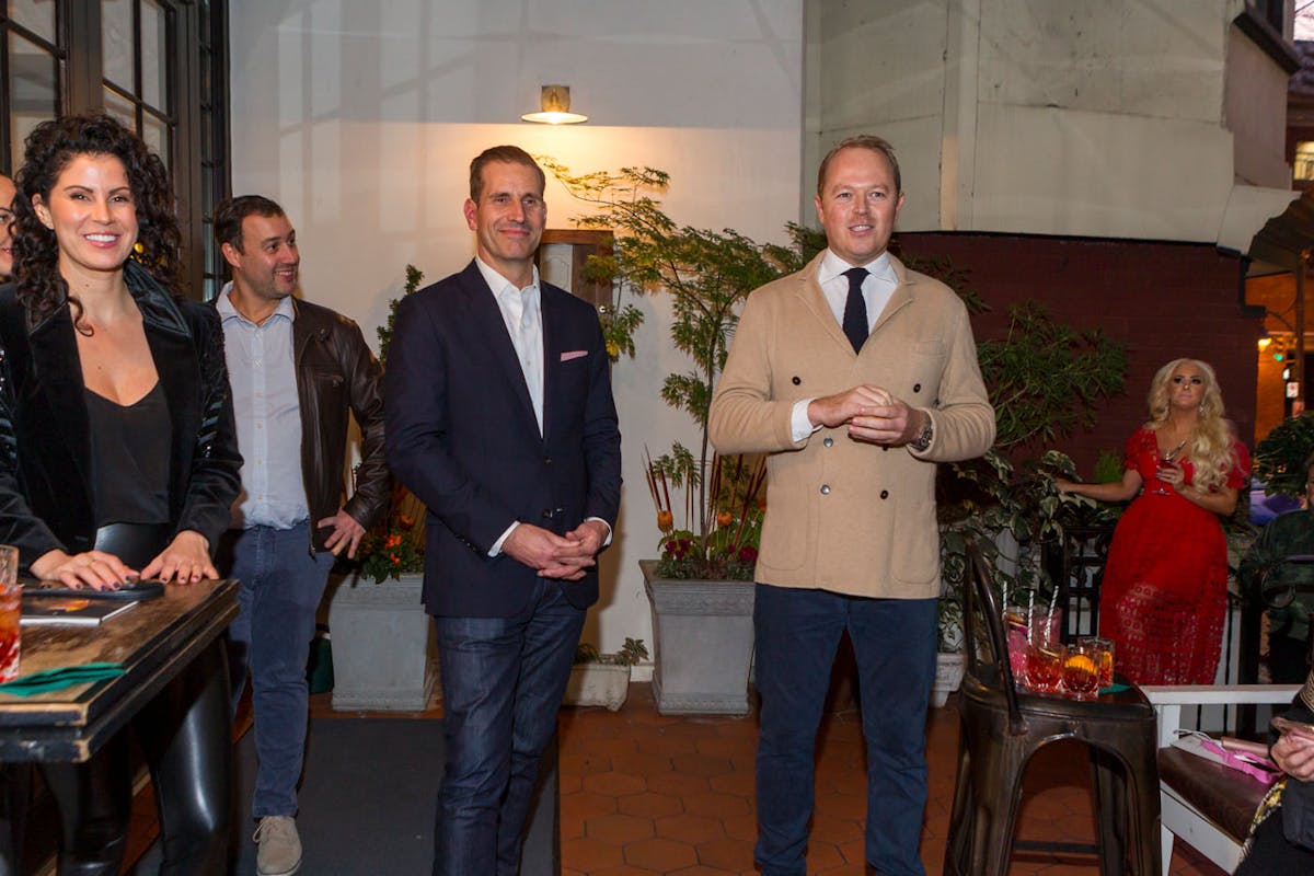 a group of people standing in a room