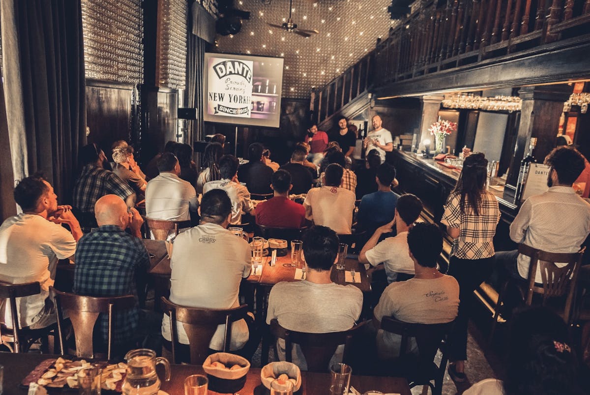 a group of people sitting at a table in a restaurant