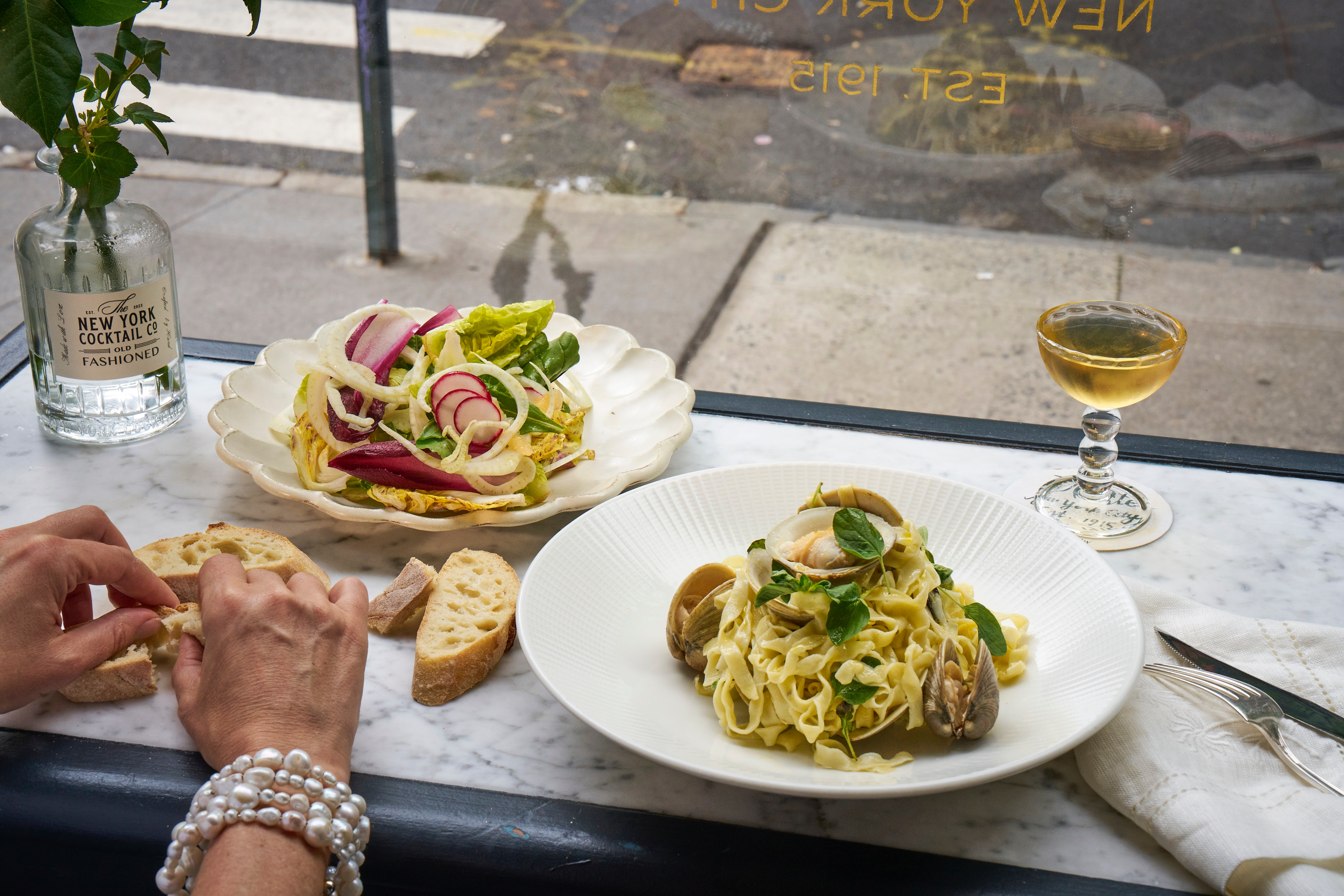 a plate of food with a glass of wine