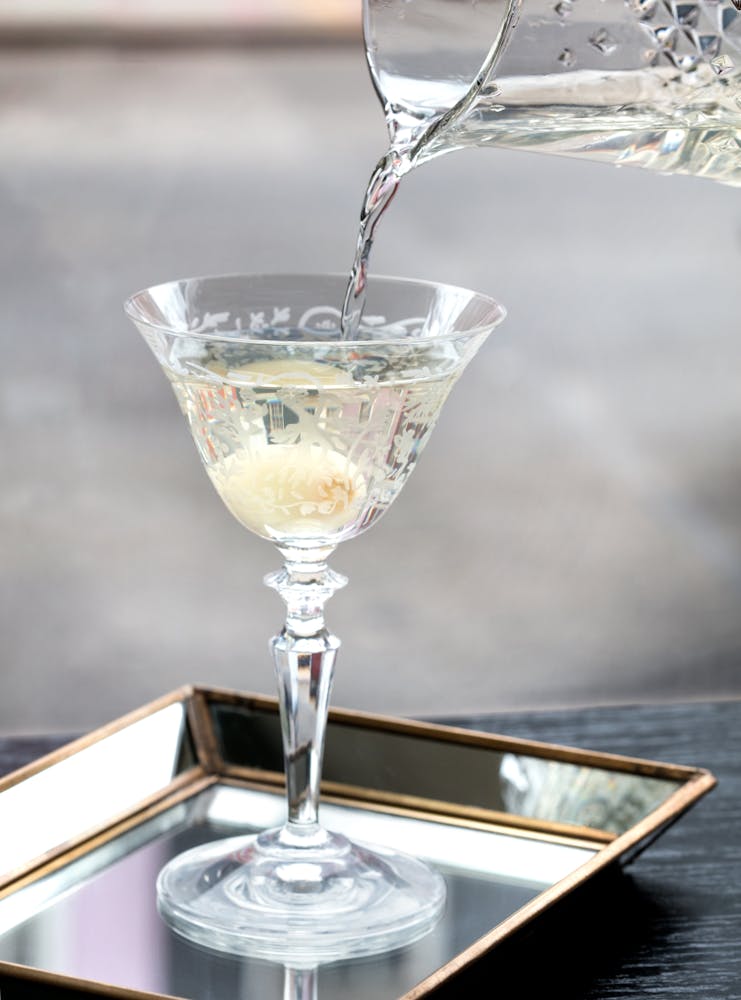a glass of martini being served