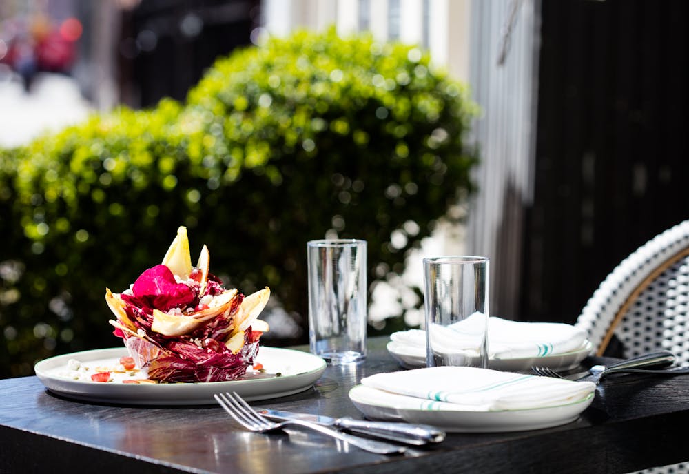 a plate of salad over a table