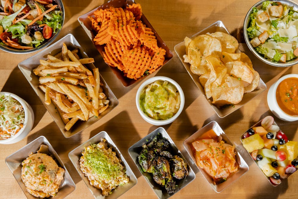 a bunch of different types of food on a table