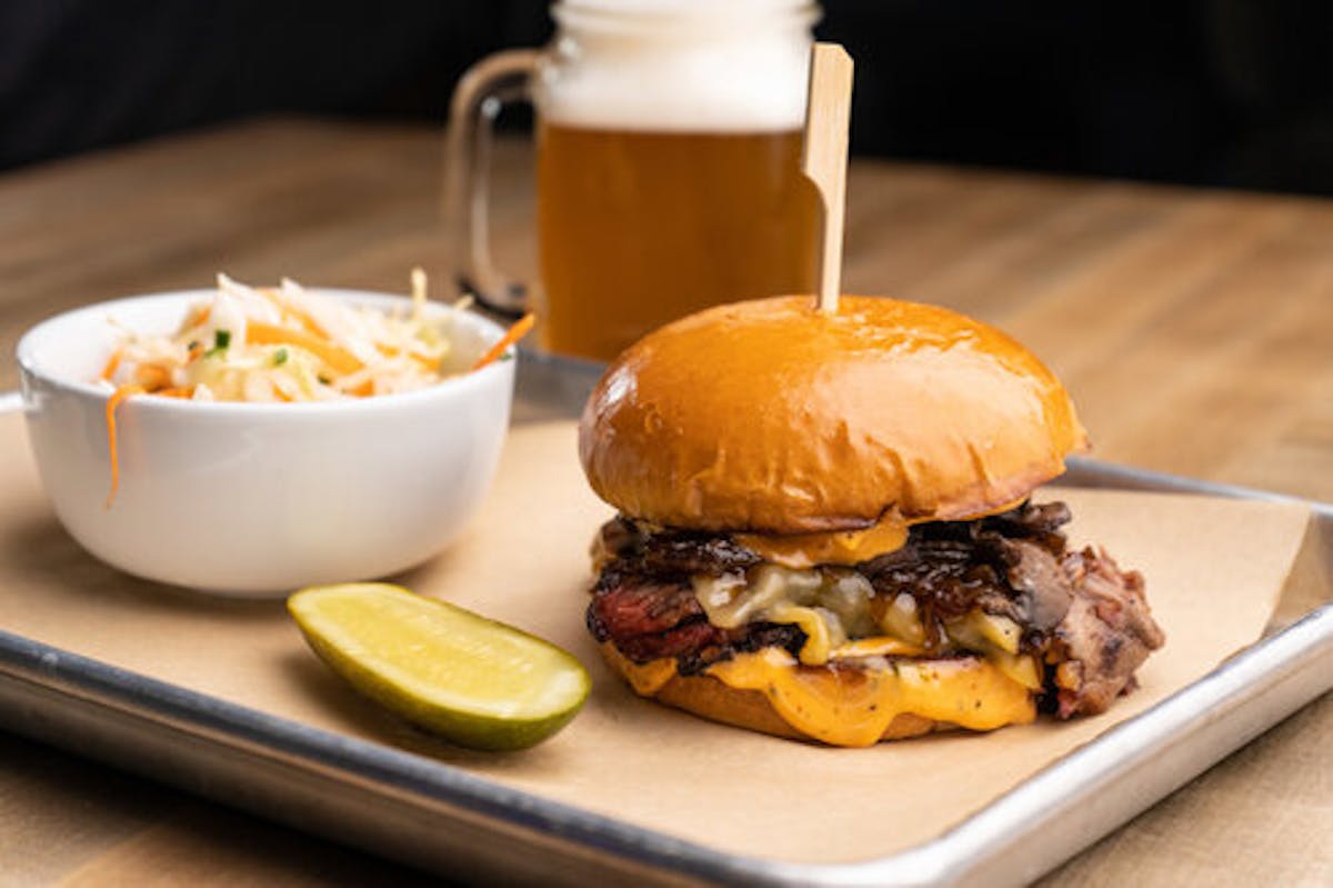 a sandwich sitting on top of a wooden table