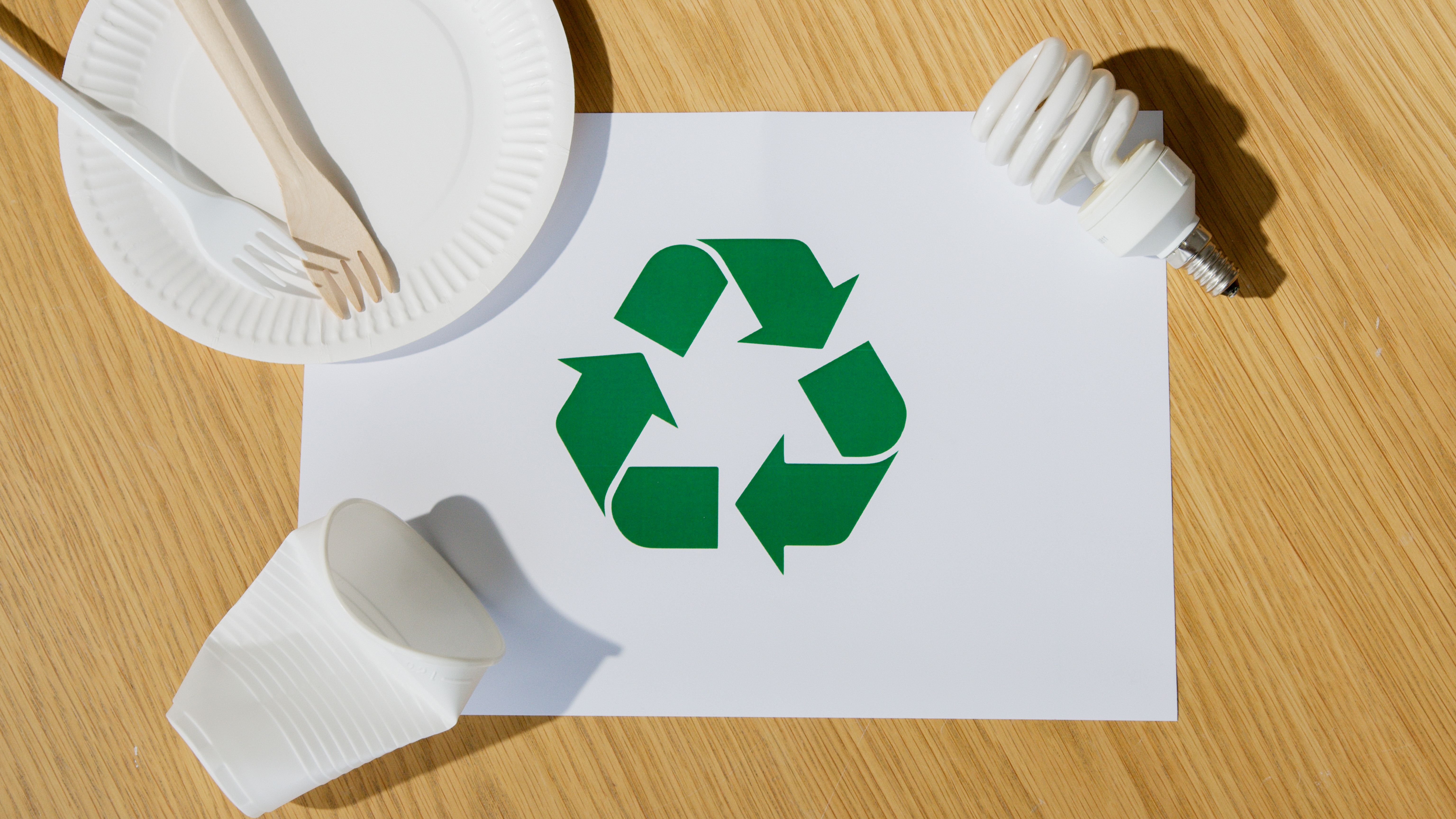 a paper with a recycle symbol on it