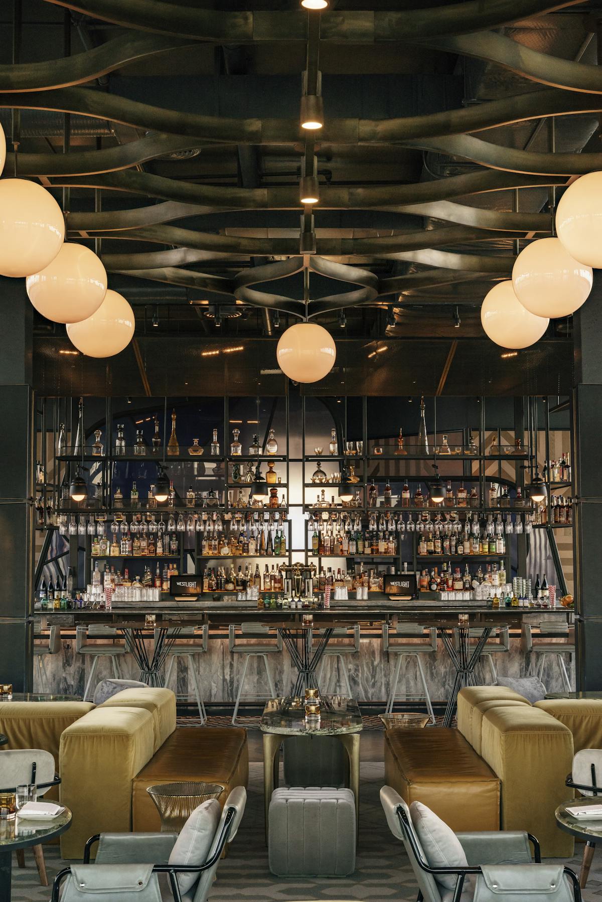 a cocktail bar and two couches next to it
