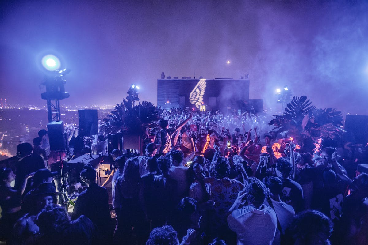 a group of people on a stage in front of a crowd