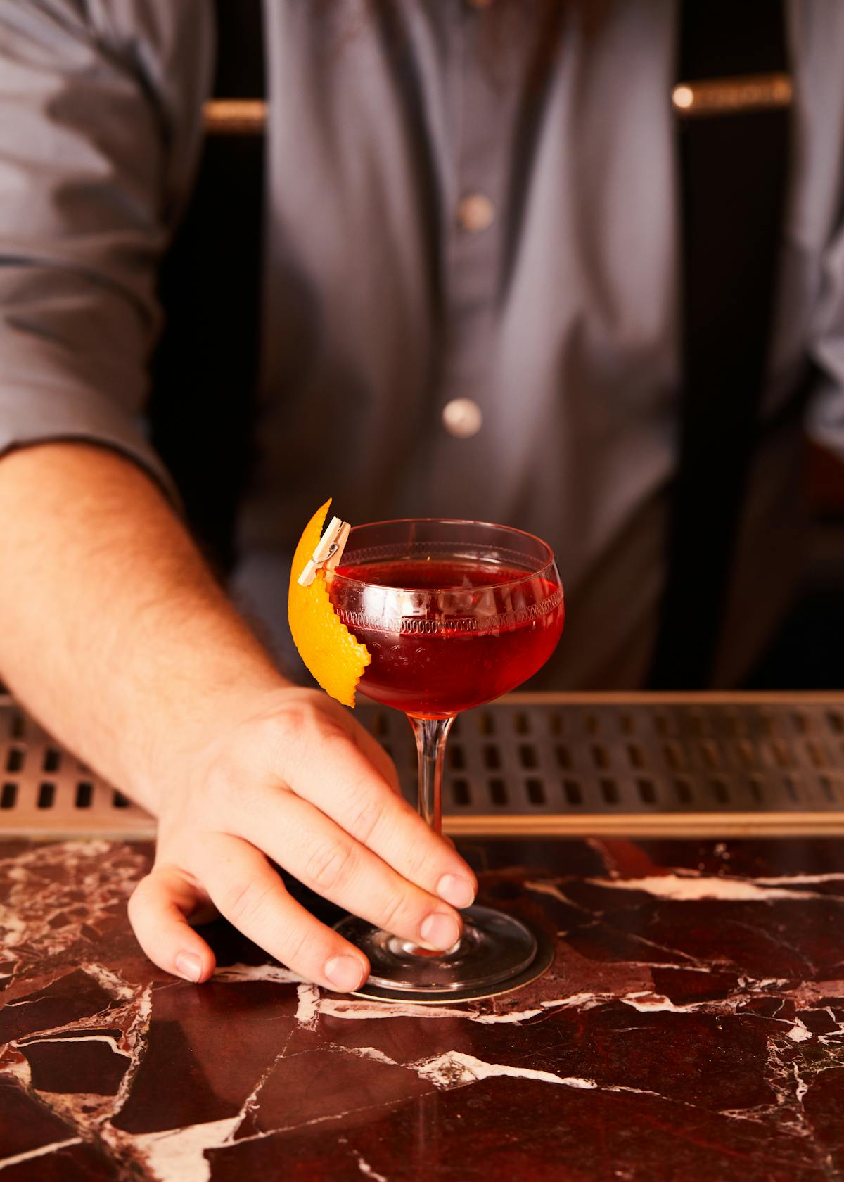 a person holding a glass of wine