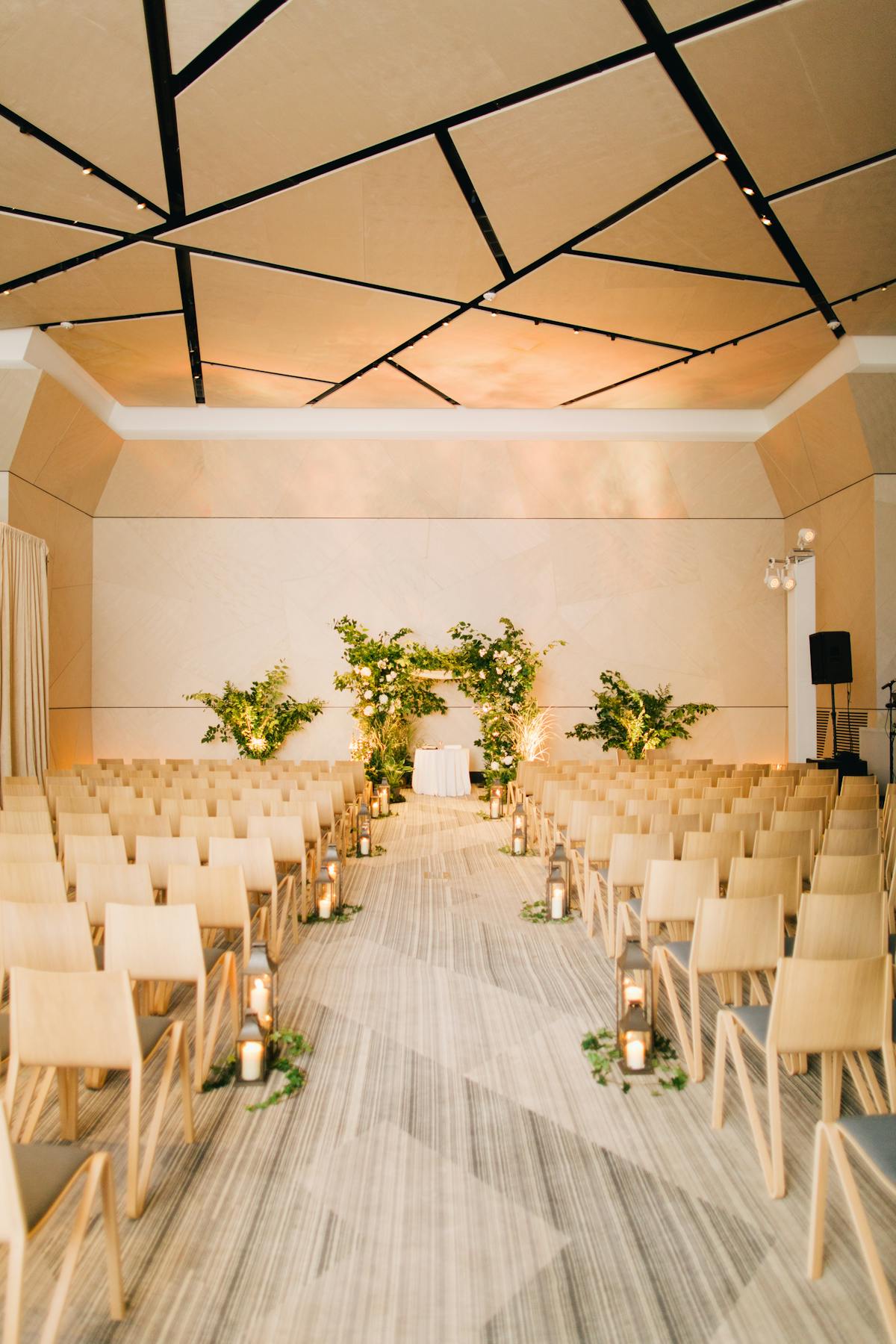 a room filled with furniture and vase of flowers on a table