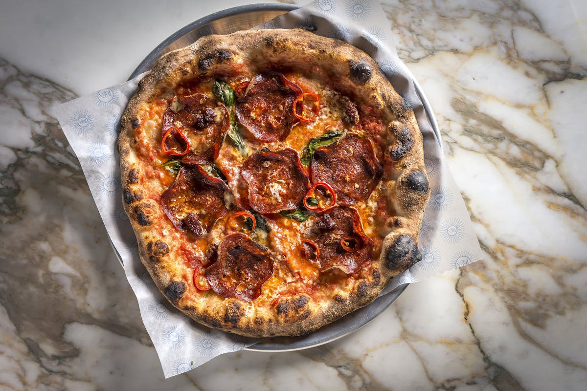 a pizza sitting on top of a table