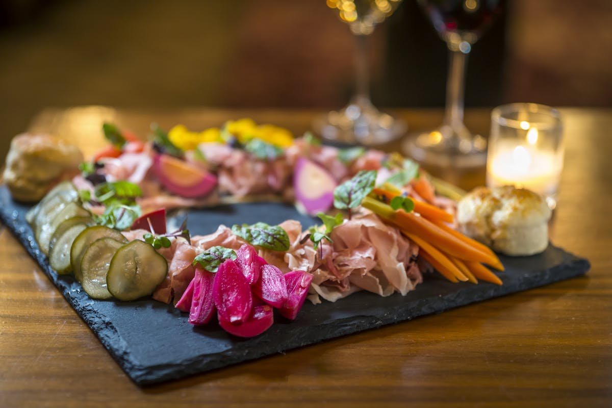 a plate of food on a wooden table