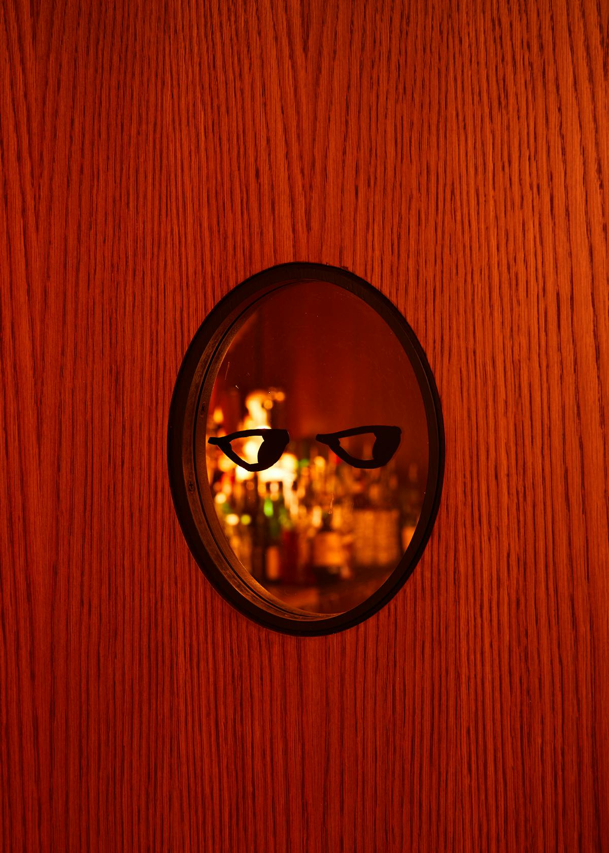 a clock on top of a wooden table