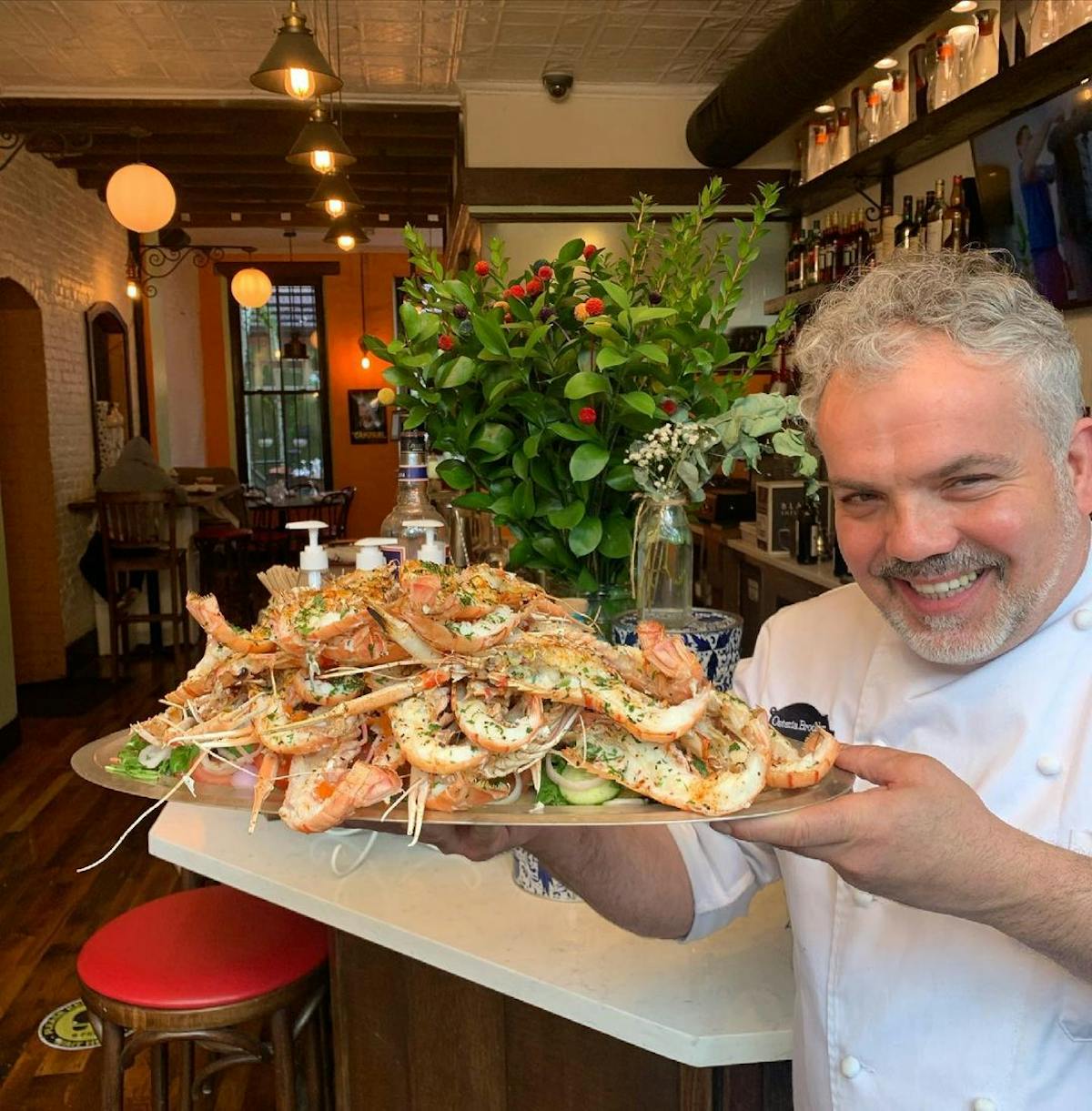 a man holding a tray of food