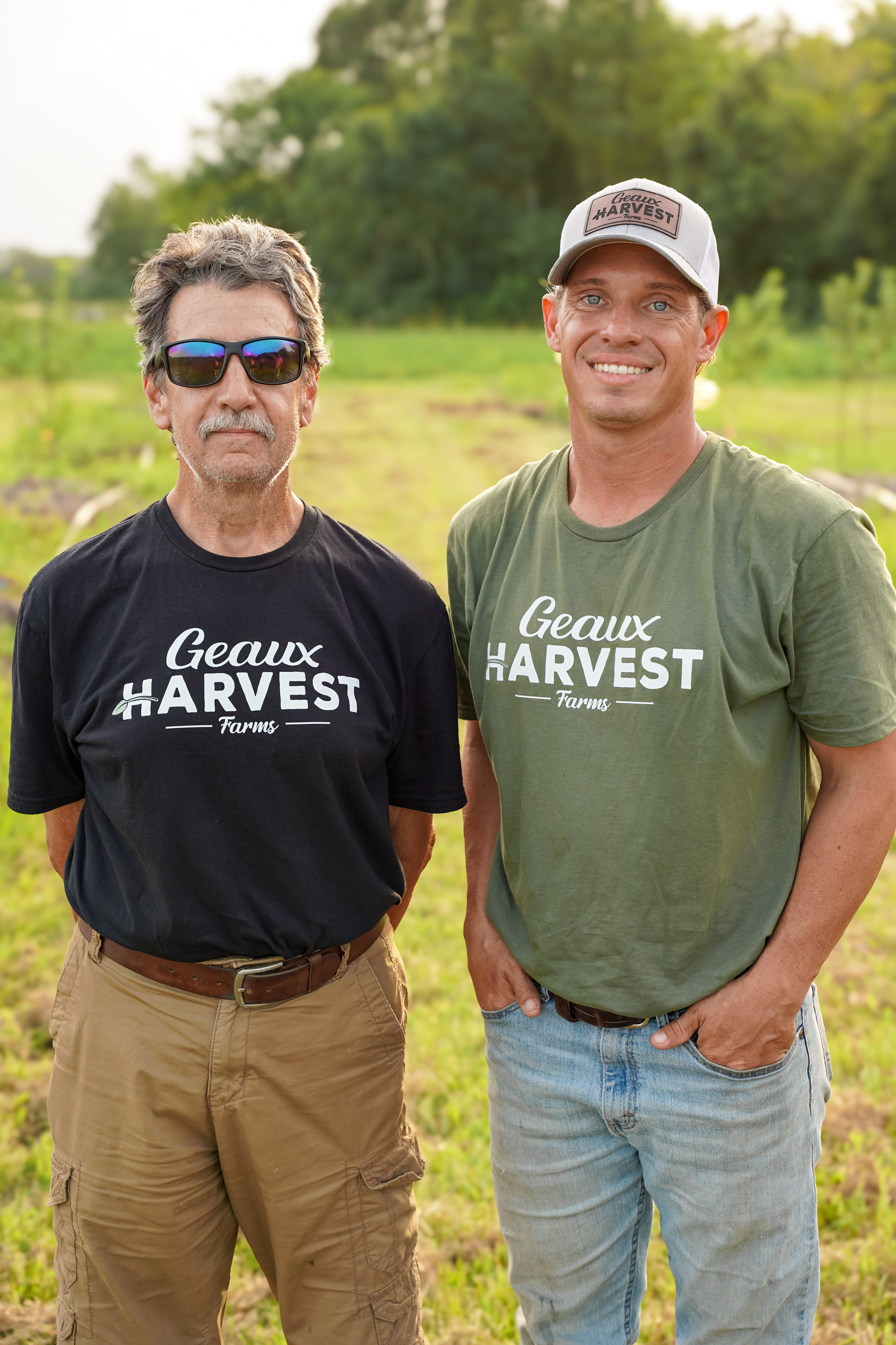 two men standing in a field