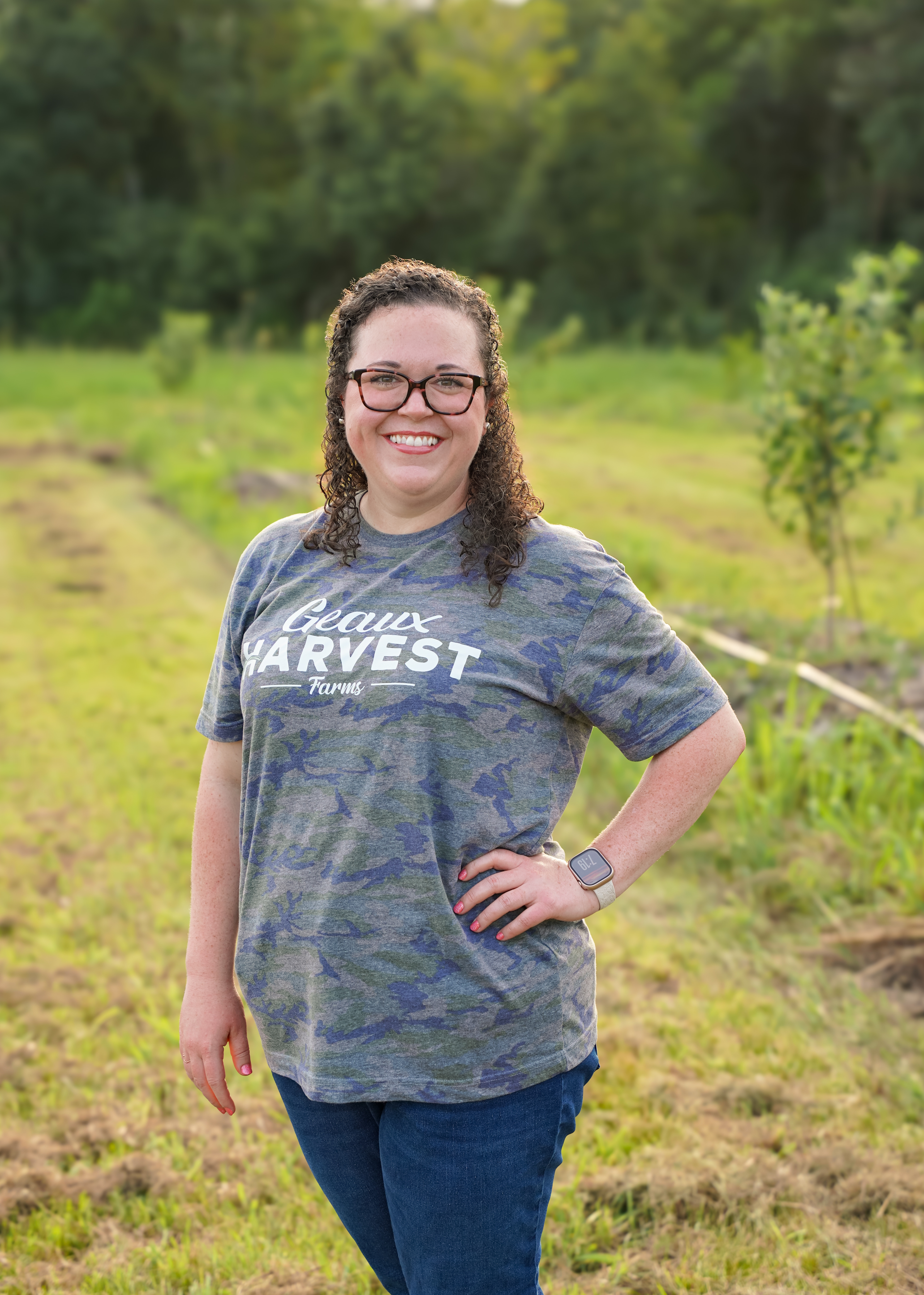 a woman standing in a field