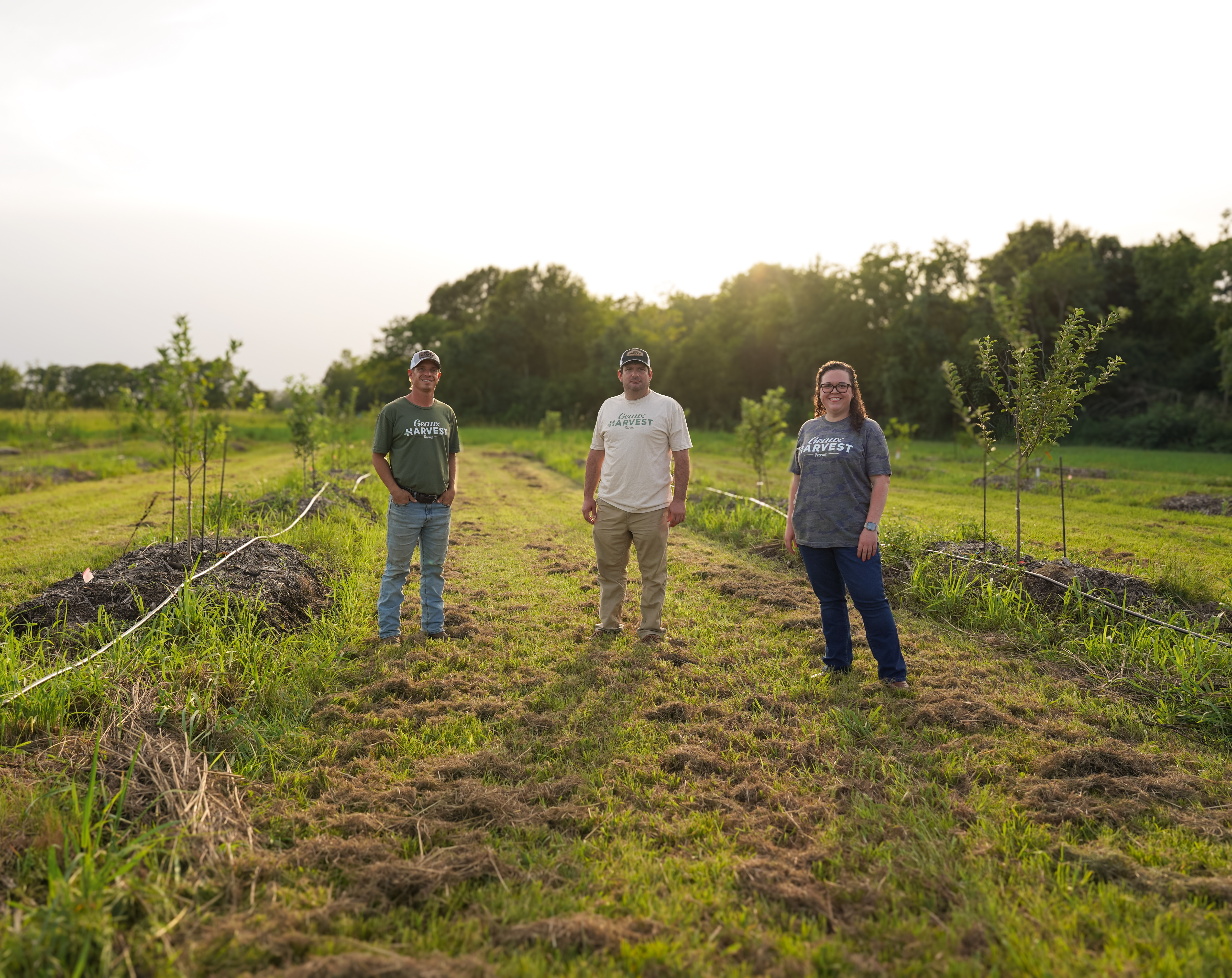 a group of people standing in a field