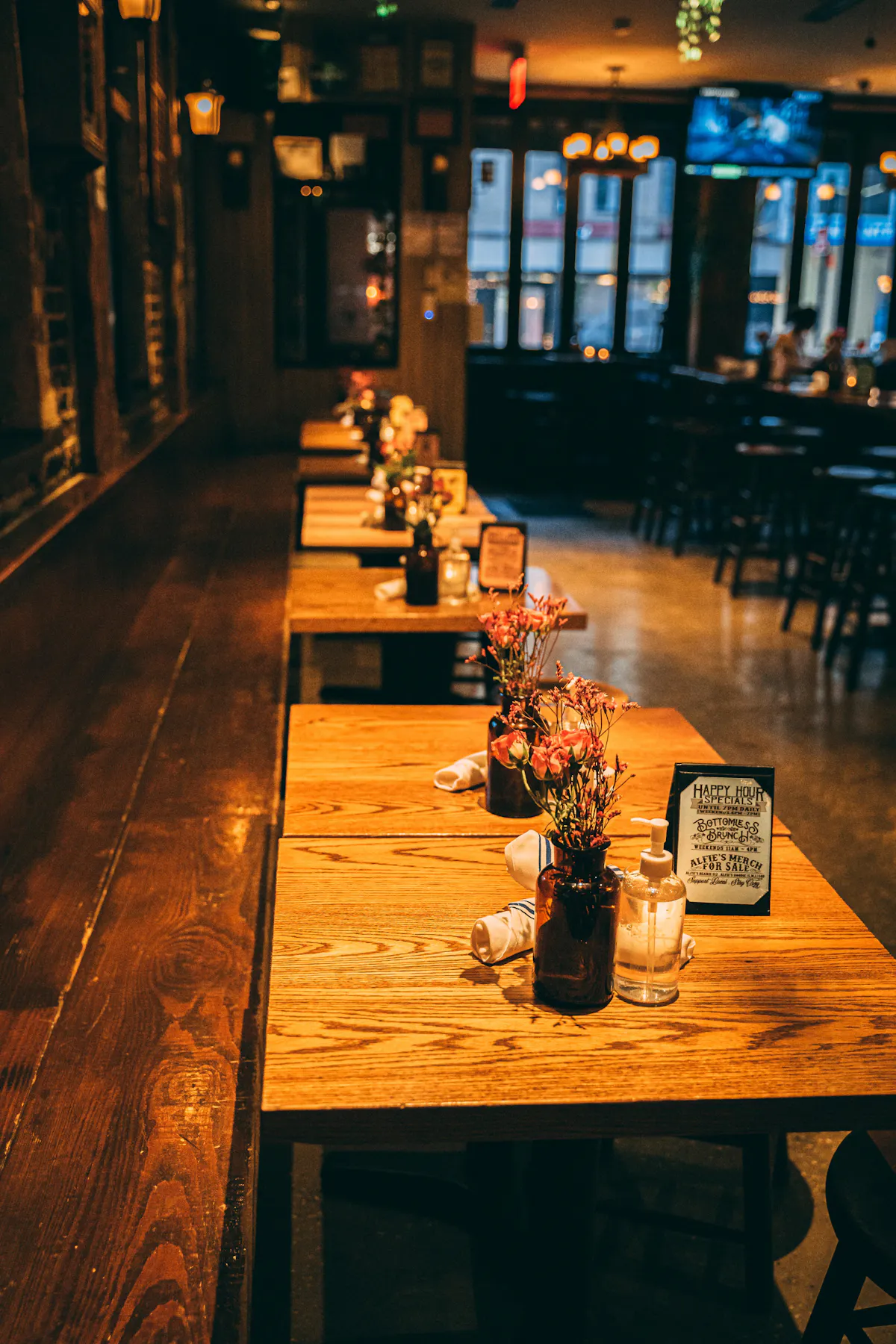 a glass of beer on a wooden table