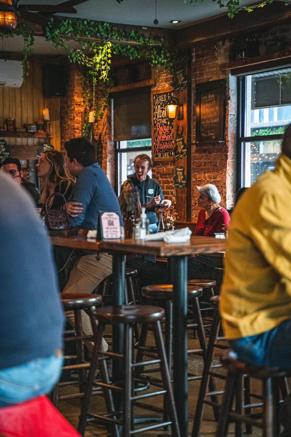 a group of people sitting at a table in a restaurant