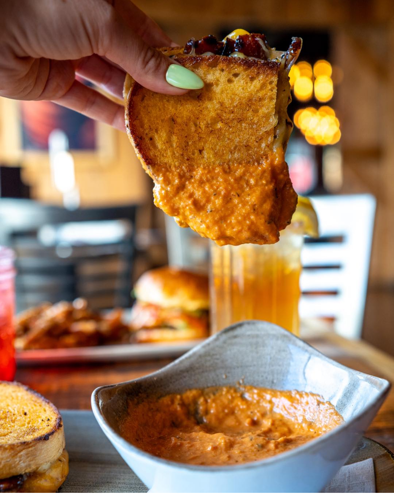 a close up of a person holding a plate of food