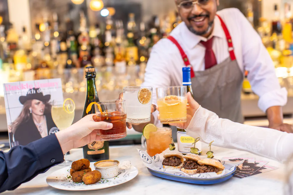 a person sitting at a table with a plate of food