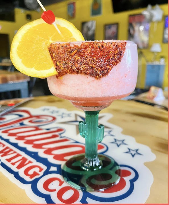 a close up of a glass of orange juice