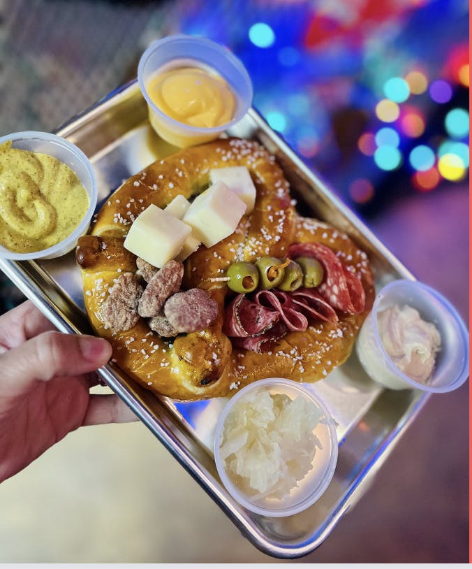 a person holding a plate of food