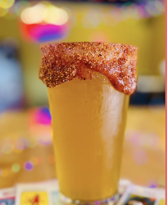 a glass of beer on a table