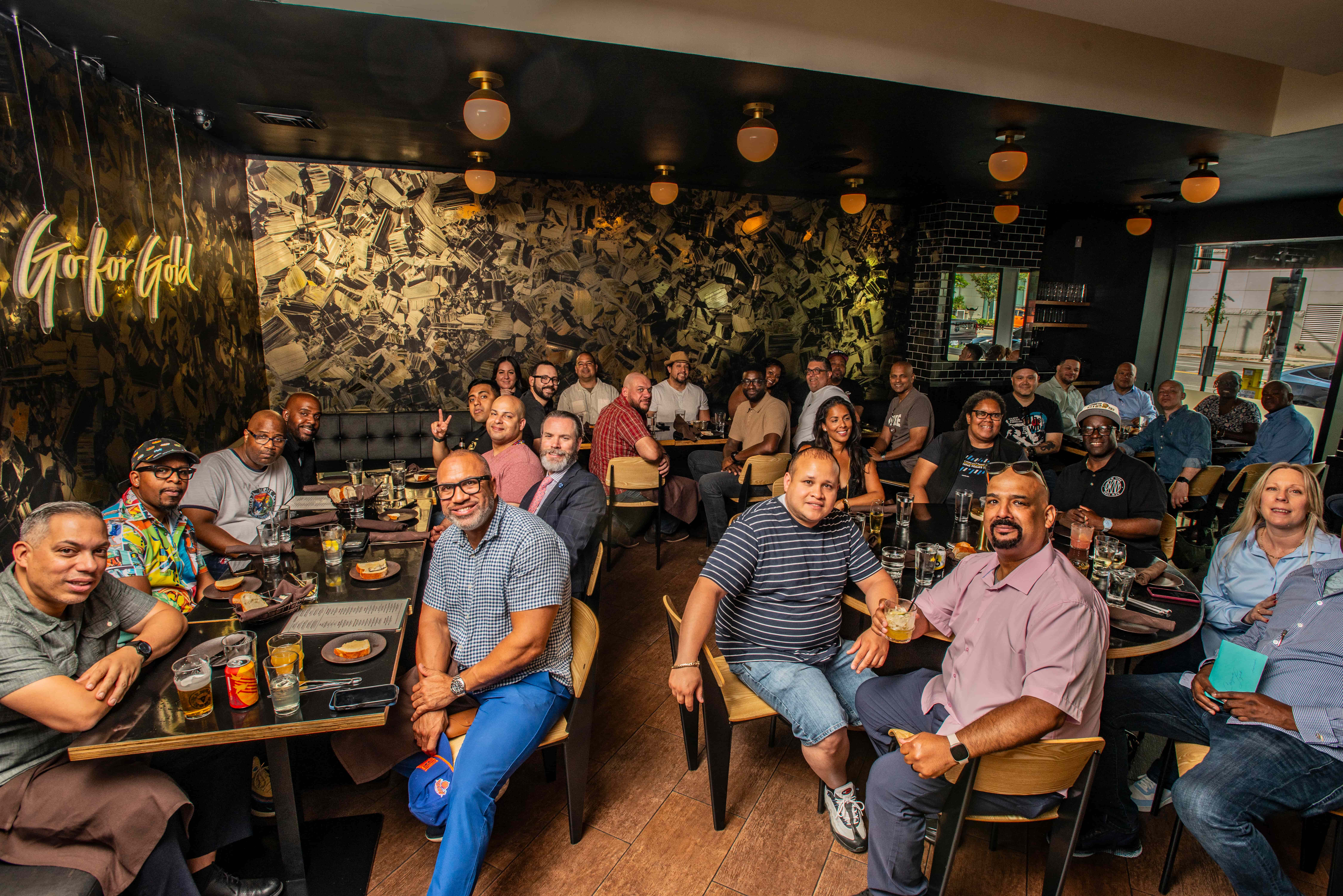 a group of people sitting at tables