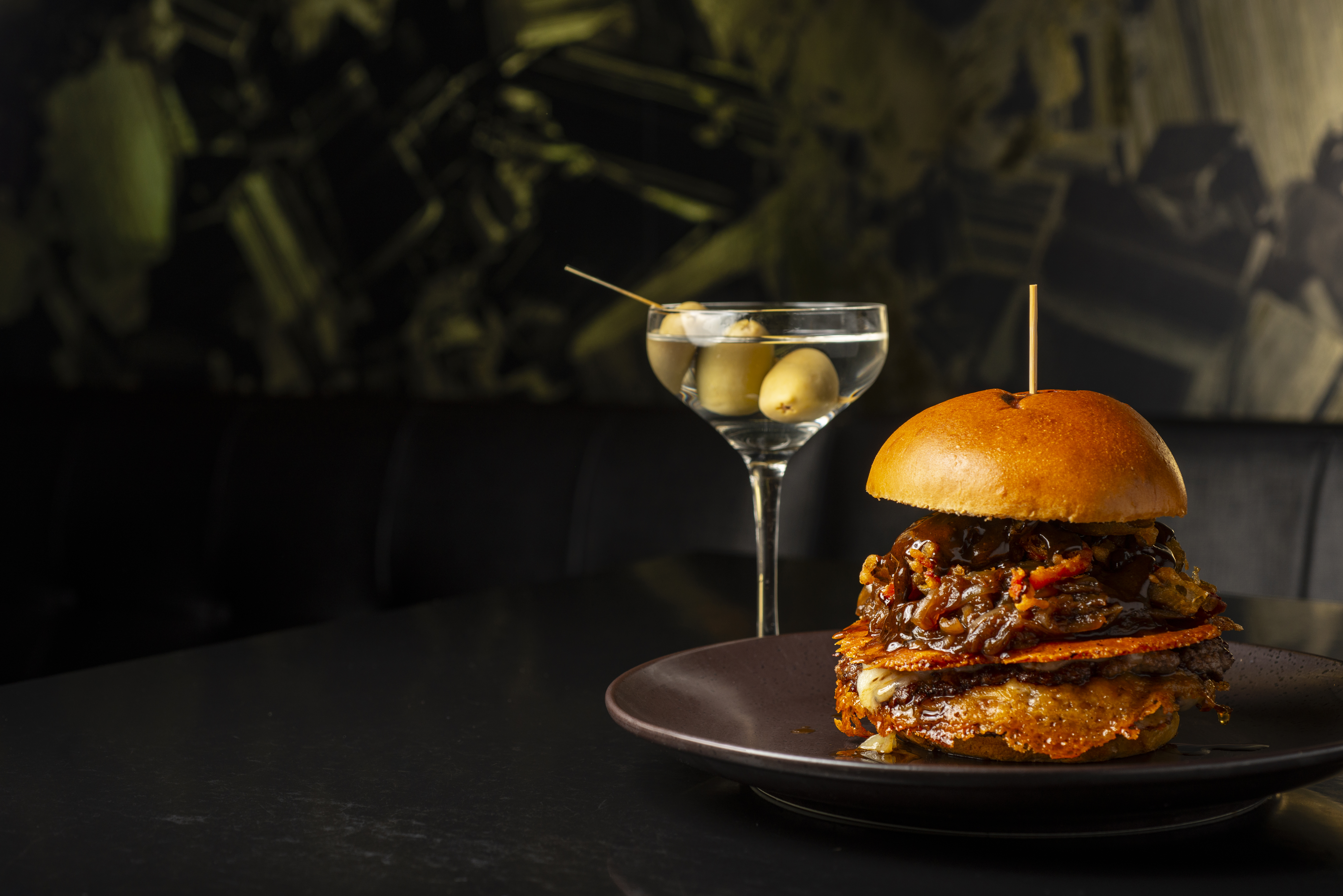 a plate of food and a glass of martini
