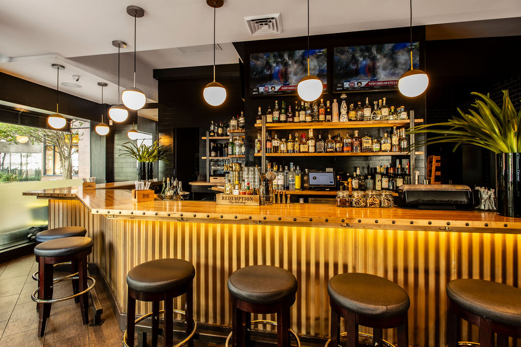 a close up of a bar with chairs