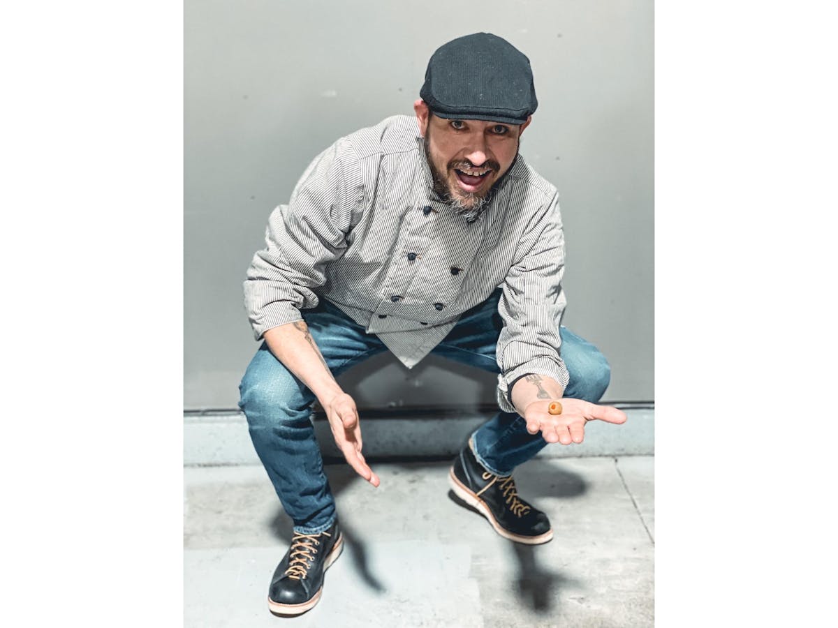a man sitting on a skateboard
