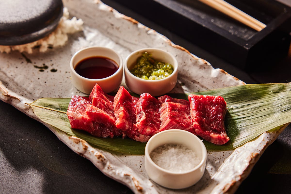 Japanese sashimi on a plate with salt and soy sauce