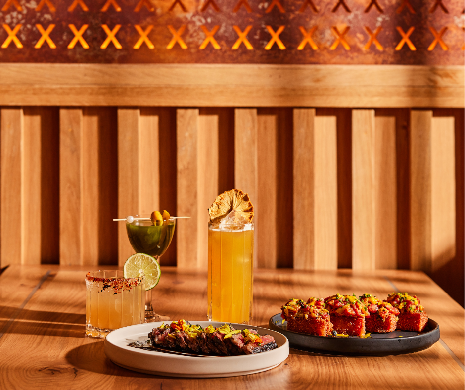 Japanese sushi and steak with specialty cocktails on tabel at XOXO Sushi Bar