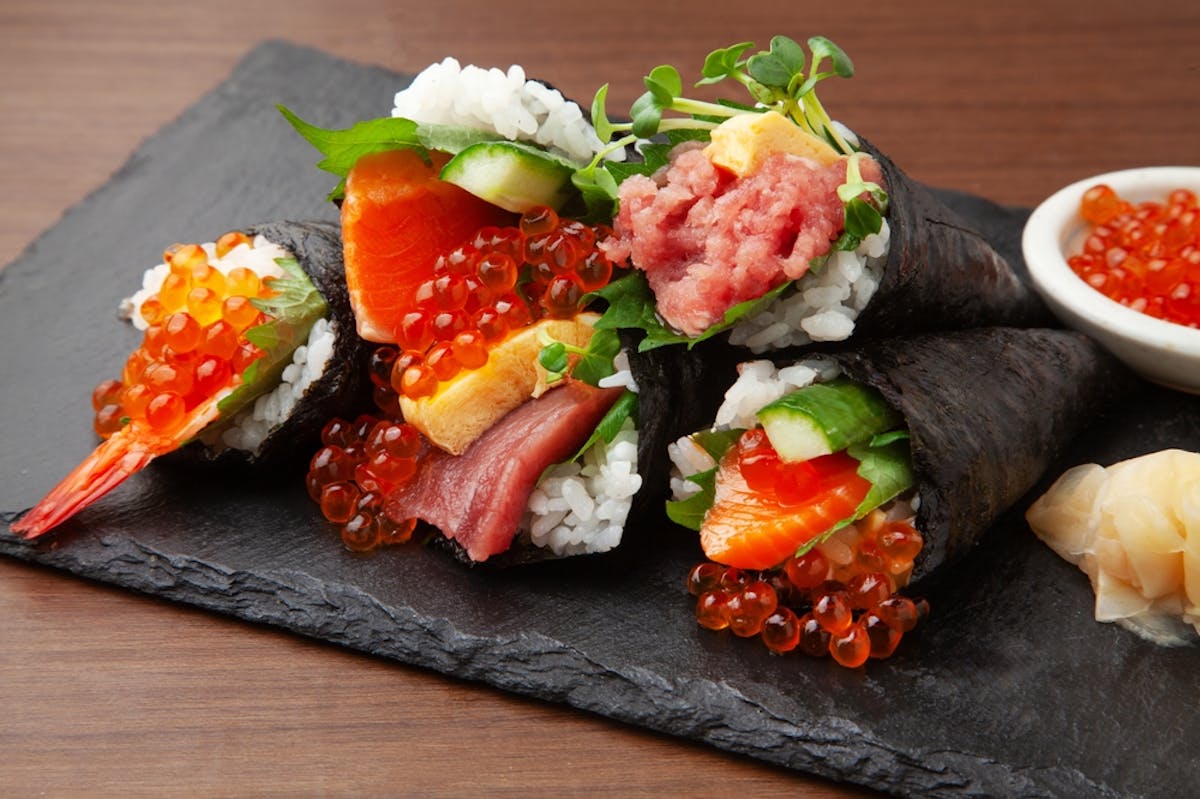 Japanese temaki handrolls on black plate