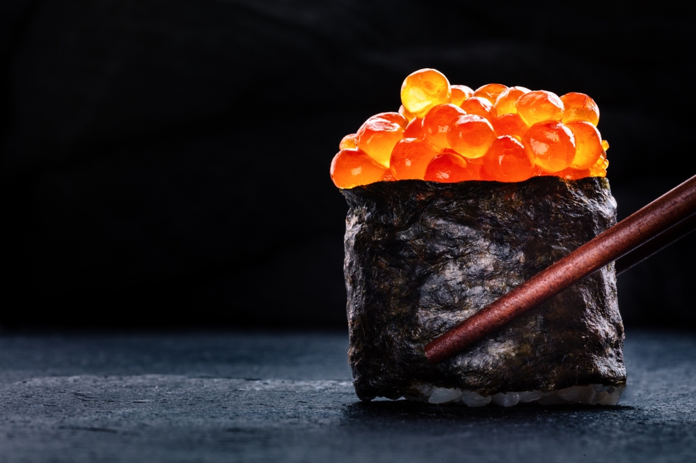 Ikura nigiri with black background