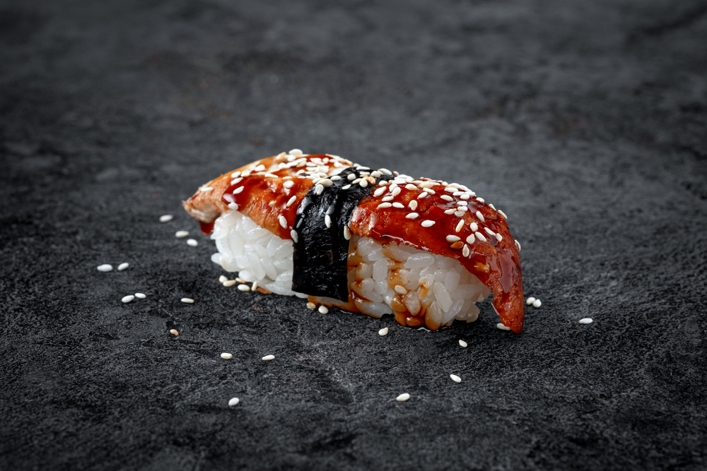 sushi nigiri eel with black stone background
