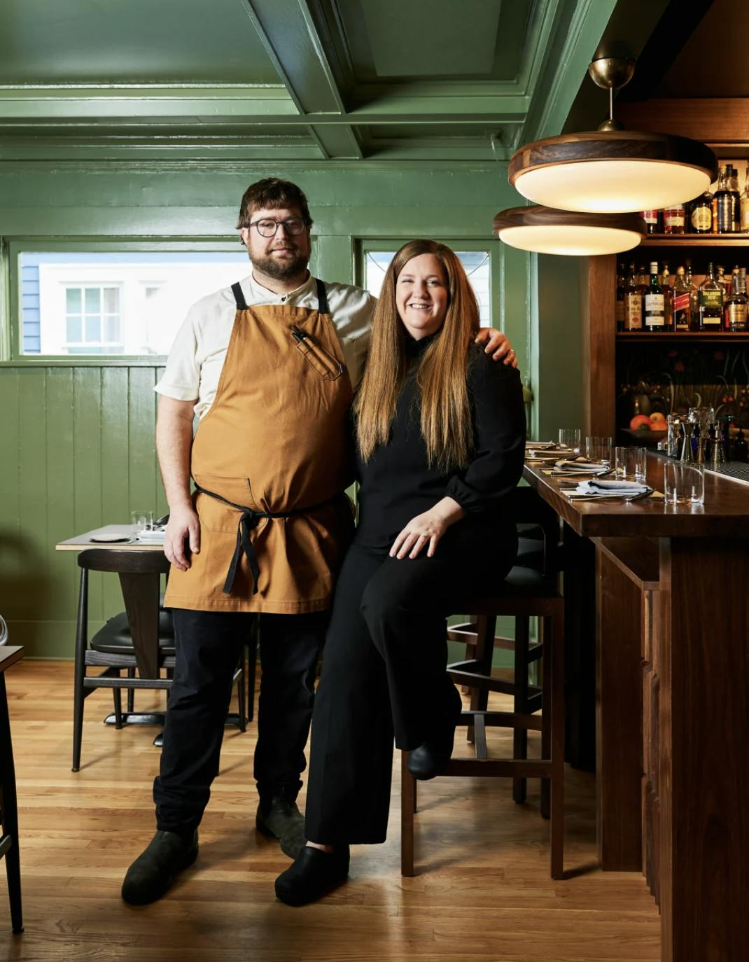 a man and a woman standing in a room