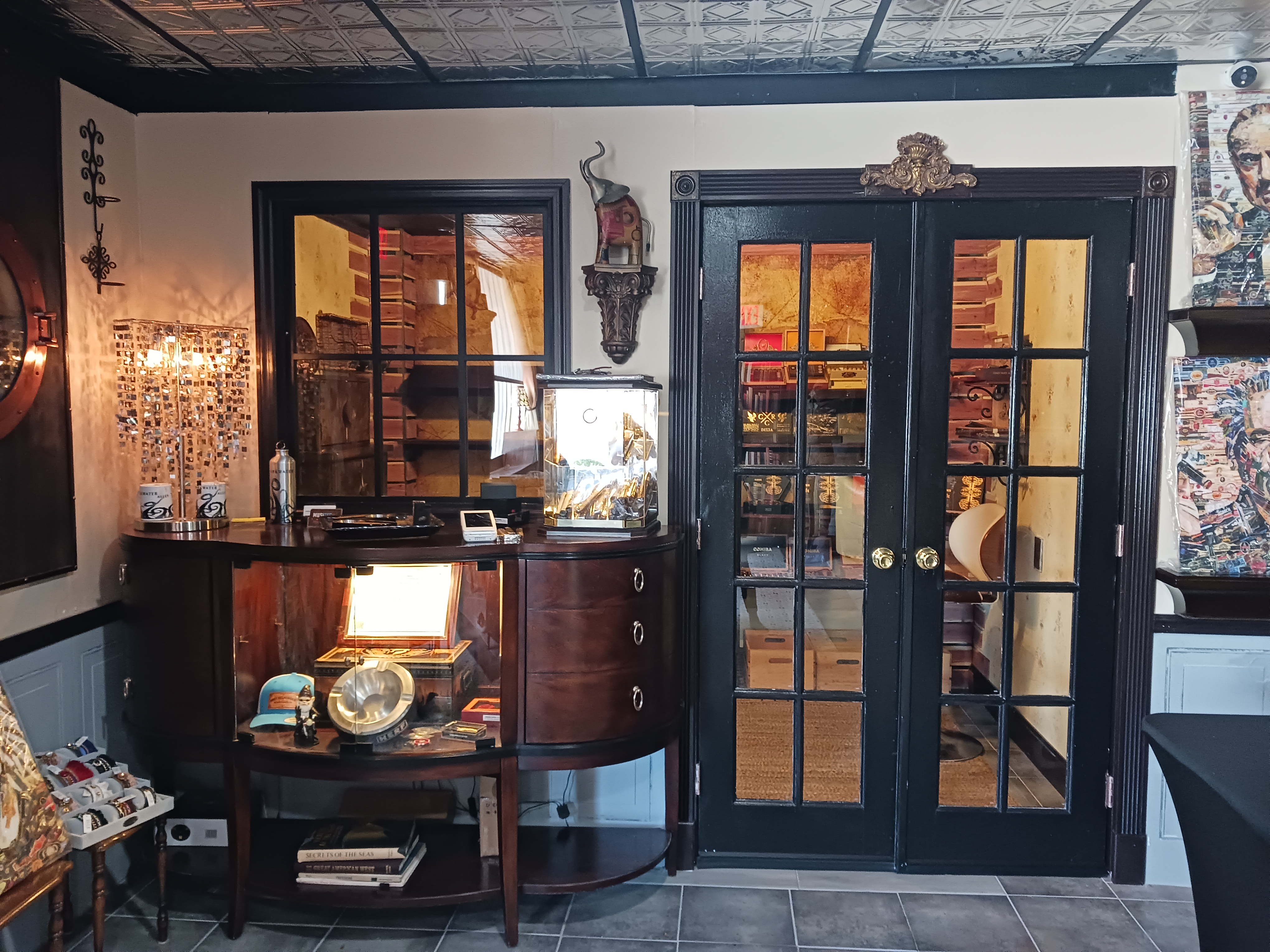 A spacious room featuring a large mirror on the wall and a door, creating an inviting atmosphere