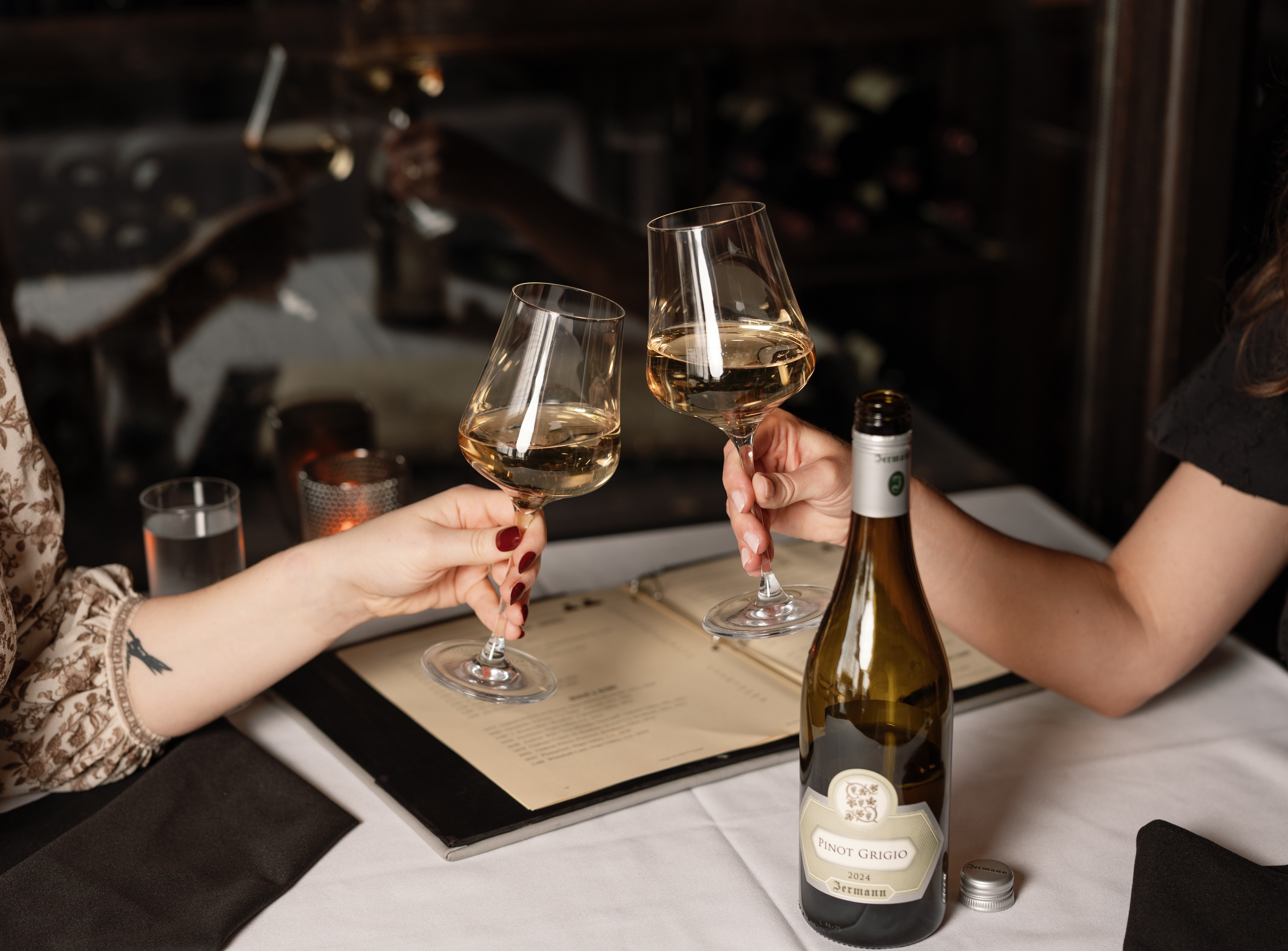 two glasses of wine and a bottle for harry & Izzy's half off bottles of wine on wednesdays