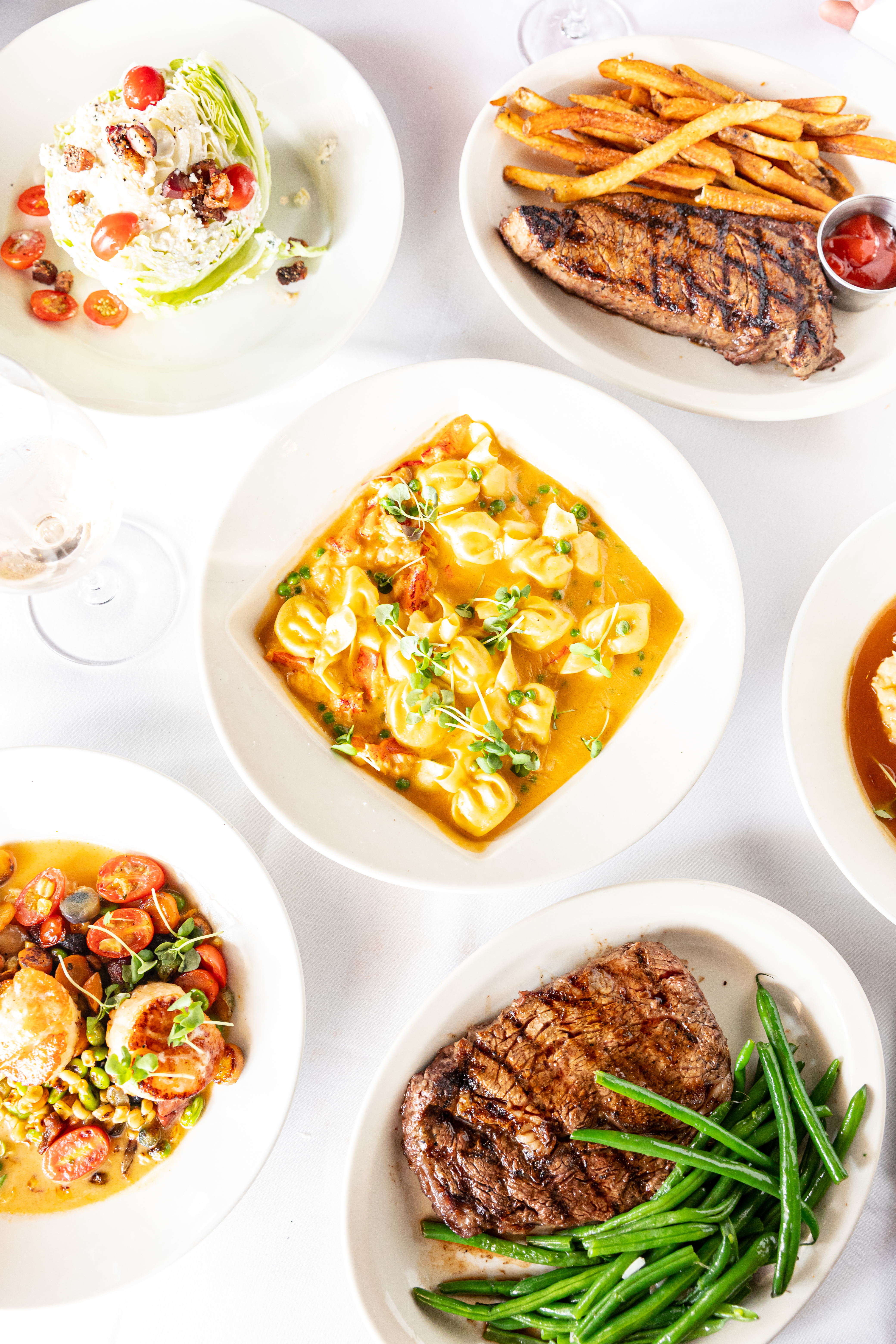 a close up of a plate of food with a sandwich and a salad