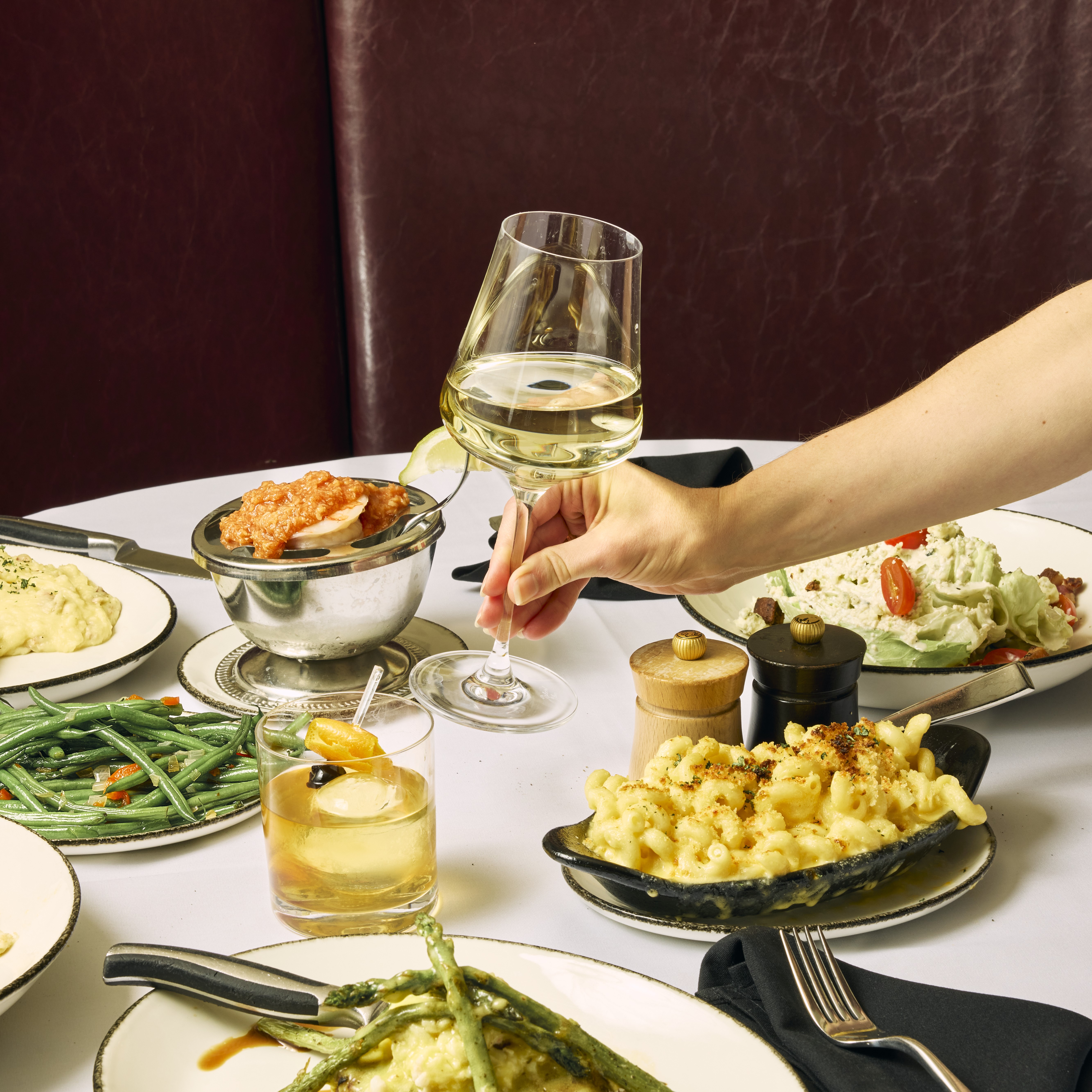 glass of wine being sat on a table at Harry & Izzy's Northside for Wine Down Wednesday