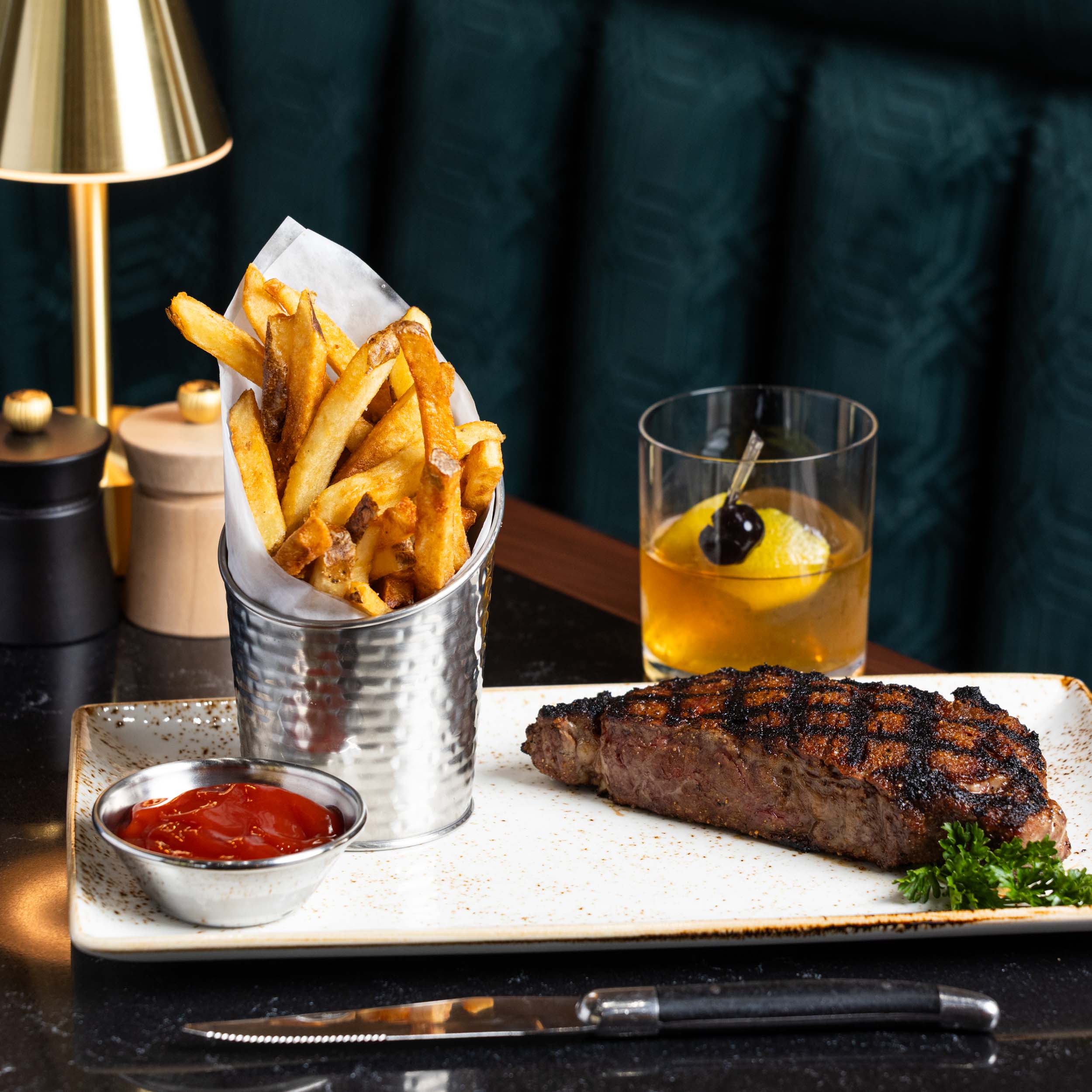 a plate of steak and fries
