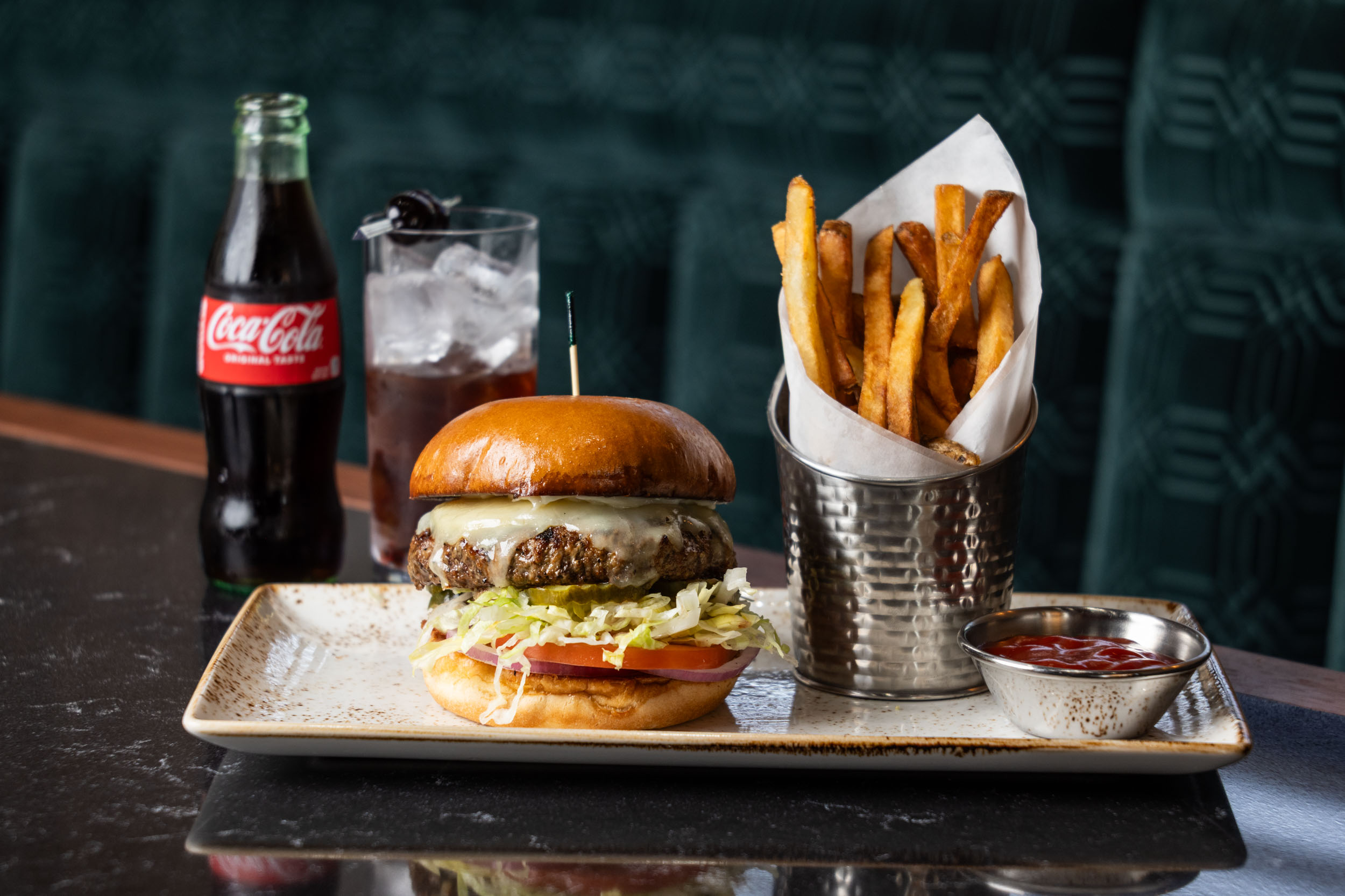 a burger and fries on a plate