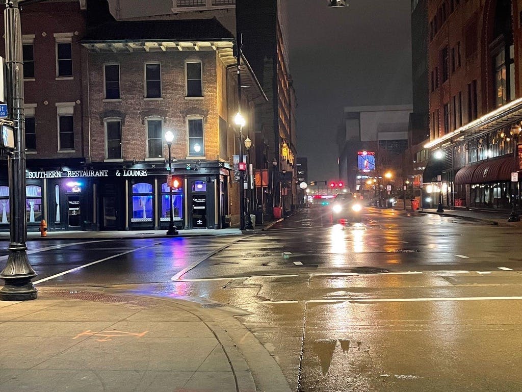 a wet city street at night