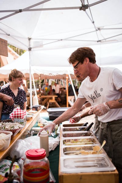 a man cooking food on a table