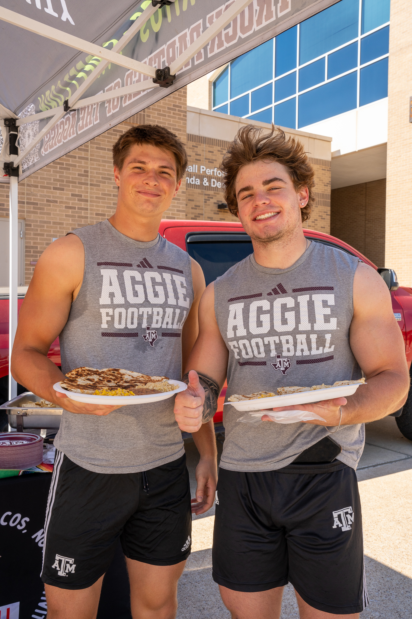Michael Christie et al. standing in front of a birthday cake