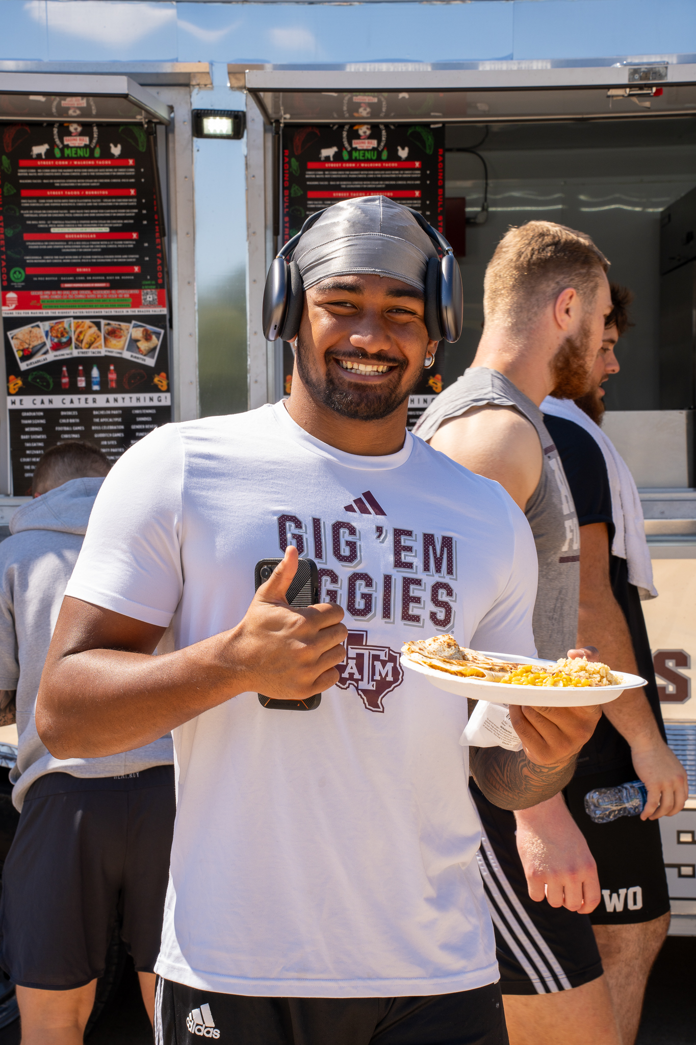 a man holding a hot dog