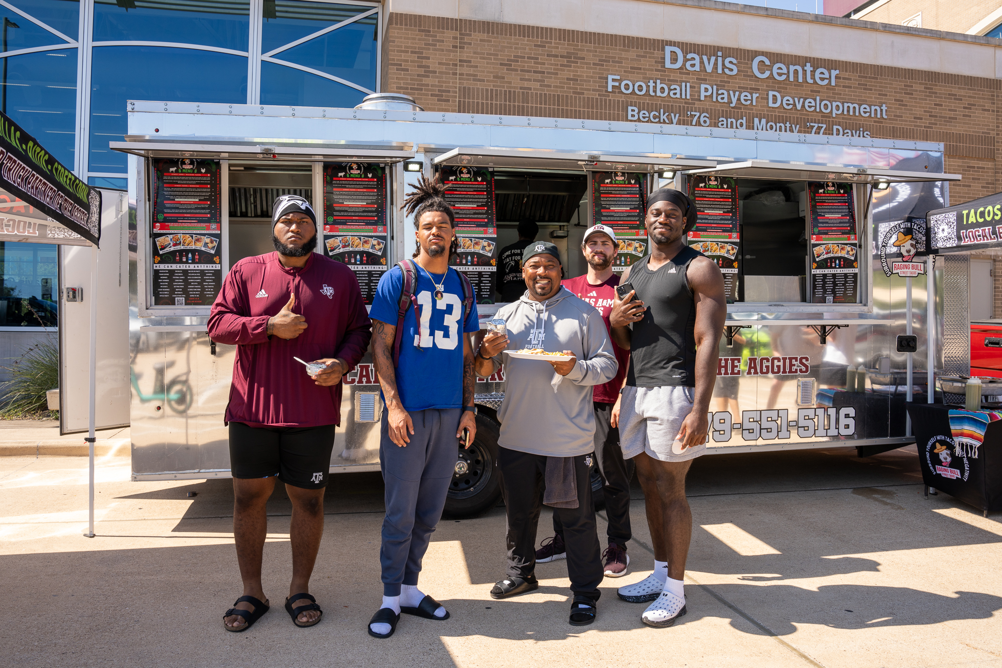 a group of people standing in front of a building